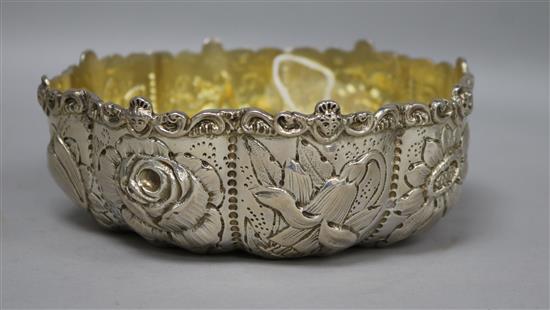 A Victorian repousse silver cusped bowl by William Comyns, London, 1885, 7 oz.